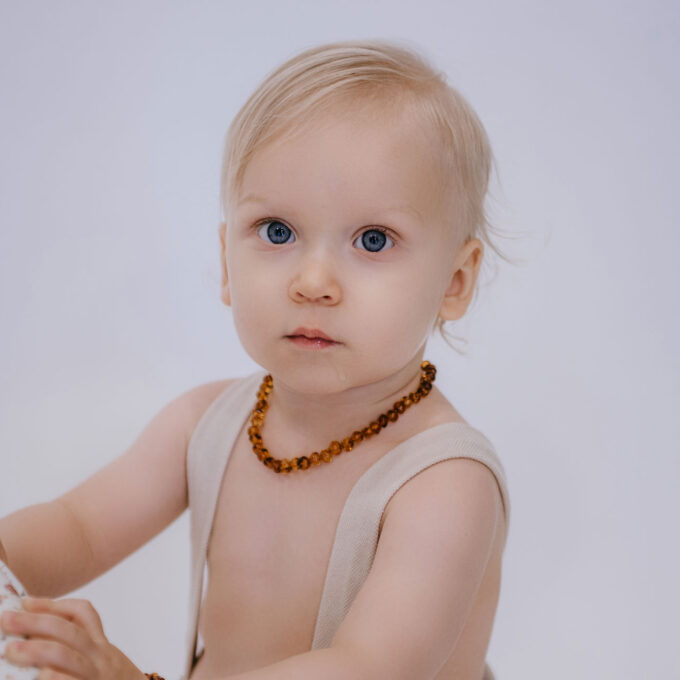 classic amber teething necklace on baby